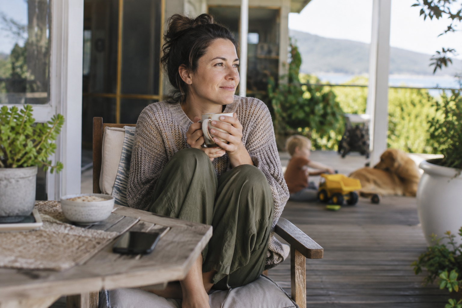 A busy parent taking a short break with a coffee on the back porch