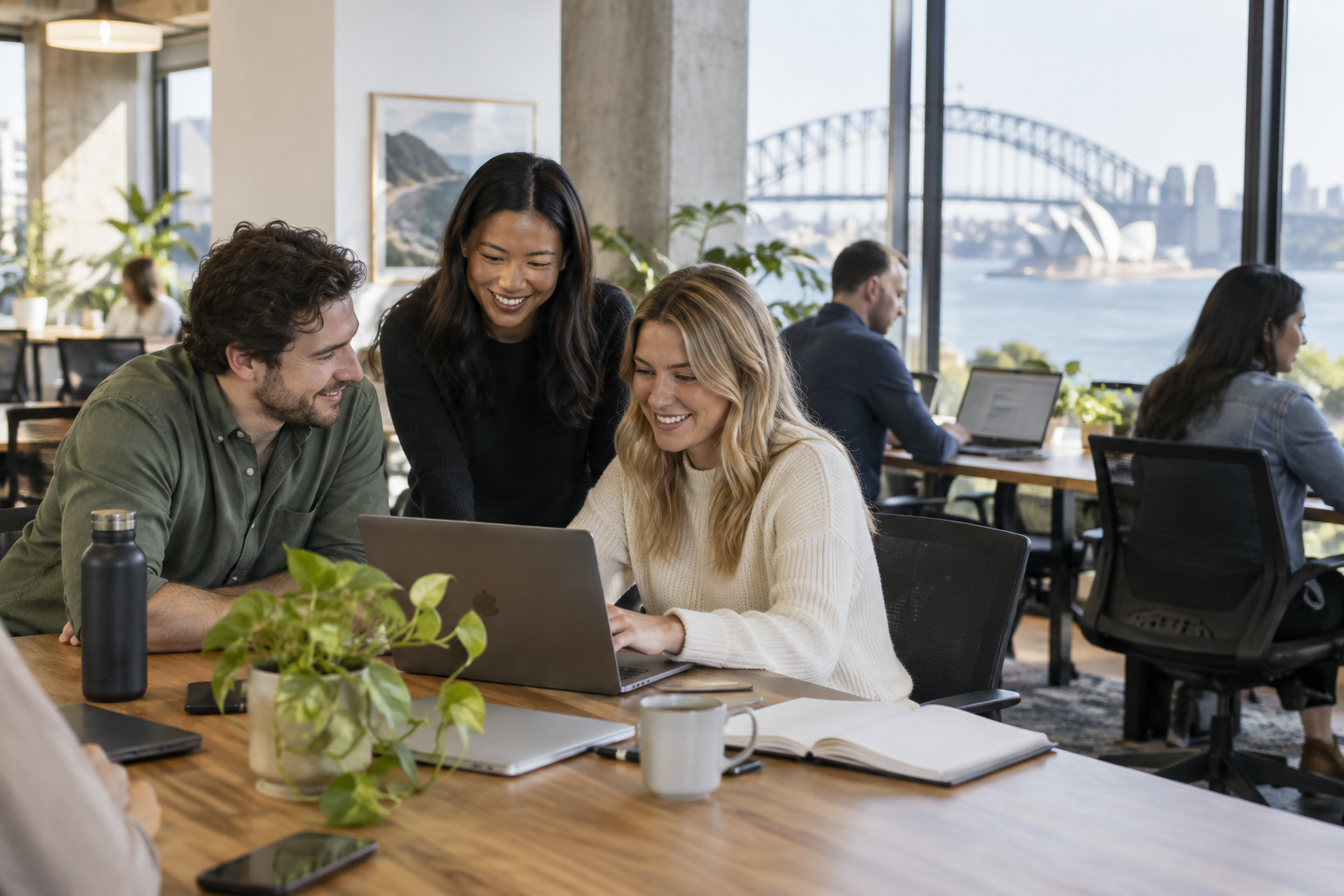 A friendly coworking space in Sydney with people collaborating at shared desks